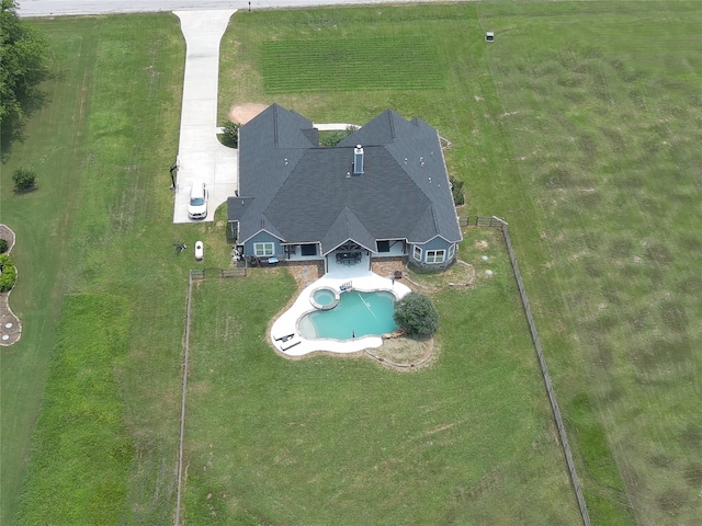 birds eye view of property with a rural view