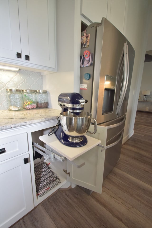 kitchen featuring tasteful backsplash, white cabinetry, dark hardwood / wood-style floors, and stainless steel refrigerator with ice dispenser