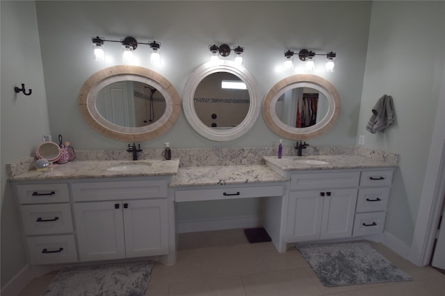 bathroom featuring tile patterned flooring and vanity