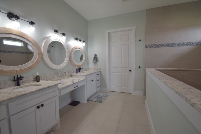 bathroom with tile patterned floors and vanity