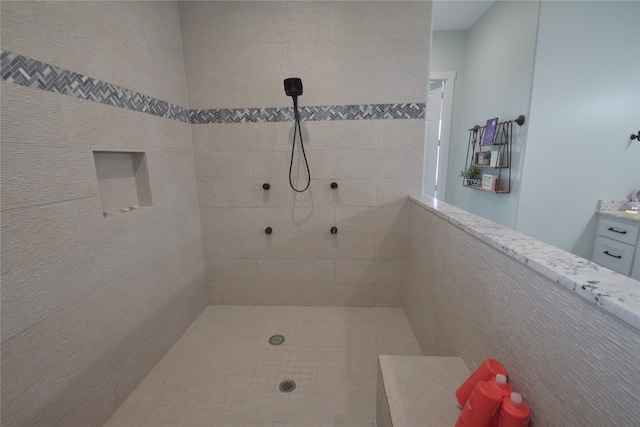 bathroom with a tile shower