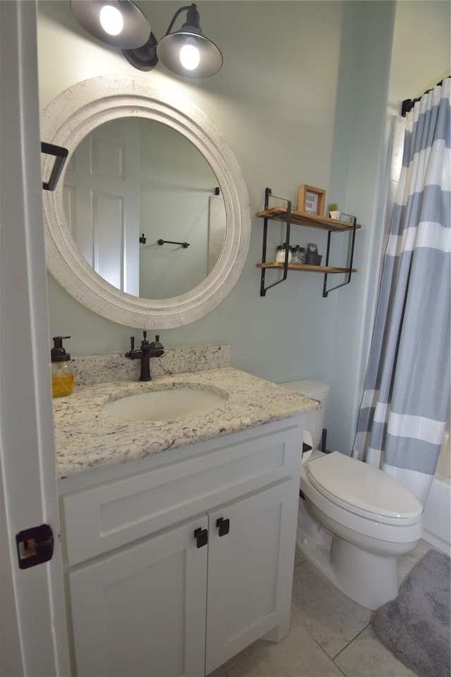 full bathroom with tile patterned flooring, vanity, toilet, and shower / bath combo with shower curtain