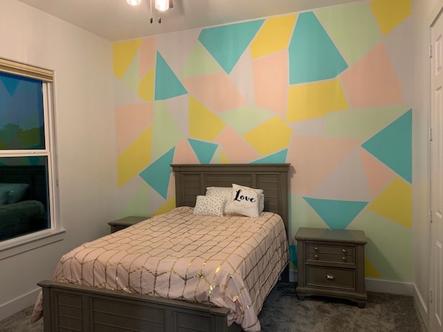 bedroom featuring dark colored carpet