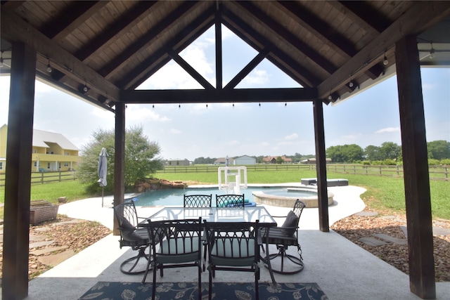 view of patio / terrace featuring a gazebo and a pool with hot tub