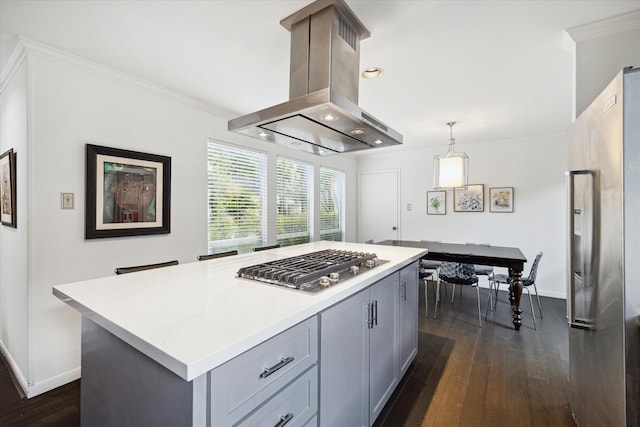 kitchen with a center island, dark wood-type flooring, island exhaust hood, decorative light fixtures, and gray cabinets