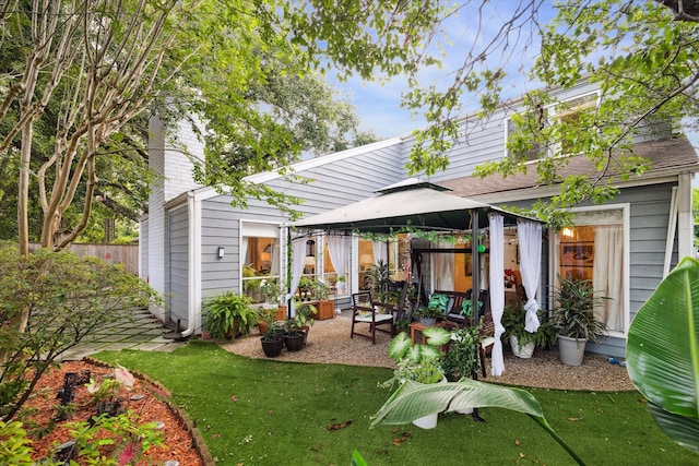 exterior space featuring a gazebo, a yard, and a patio