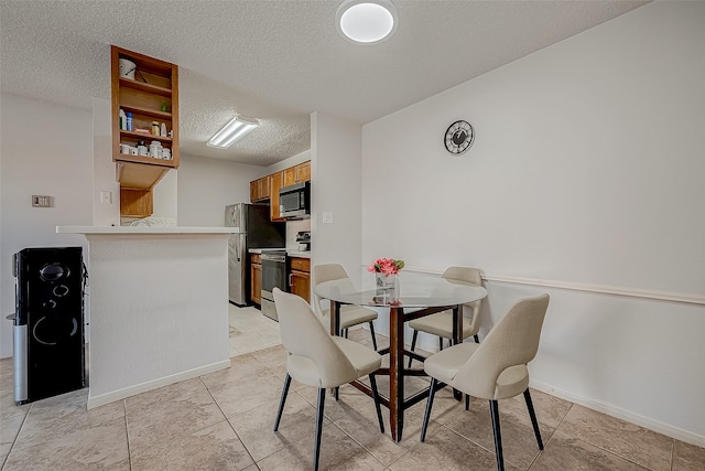 dining area with a textured ceiling