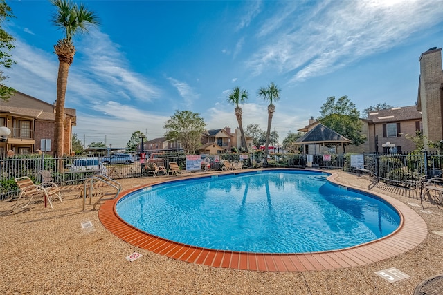 view of pool with a gazebo and a patio