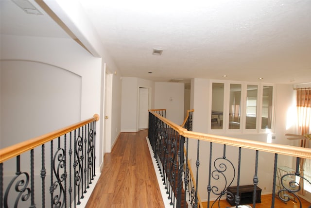 hallway featuring hardwood / wood-style flooring