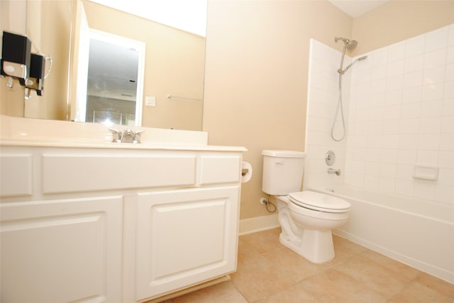 full bathroom featuring tile patterned flooring, vanity, tiled shower / bath combo, and toilet