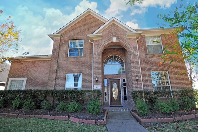 traditional home with brick siding