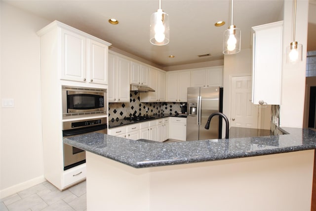 kitchen featuring pendant lighting, backsplash, kitchen peninsula, appliances with stainless steel finishes, and white cabinetry