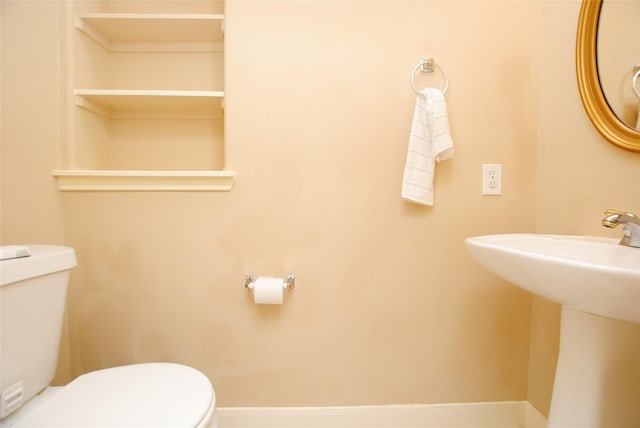 bathroom featuring sink and toilet