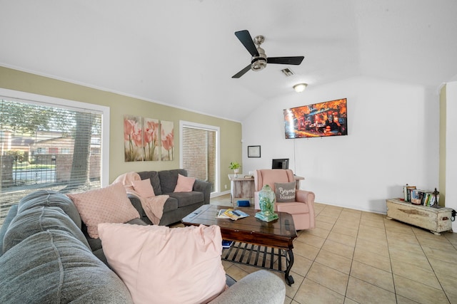 tiled living room featuring ceiling fan and lofted ceiling