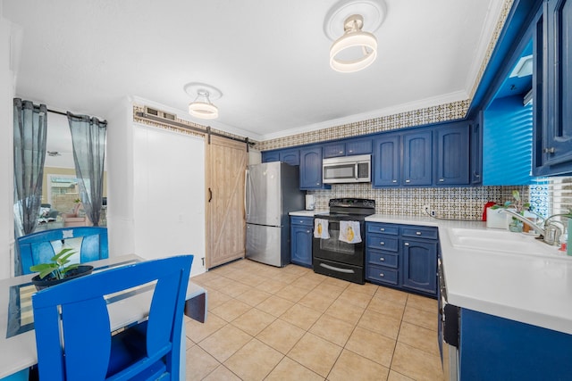 kitchen with blue cabinetry, sink, stainless steel appliances, a barn door, and crown molding