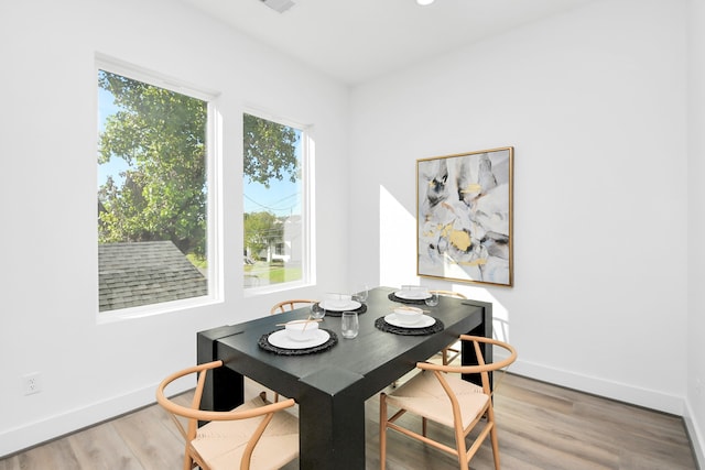 dining space featuring hardwood / wood-style floors and a wealth of natural light