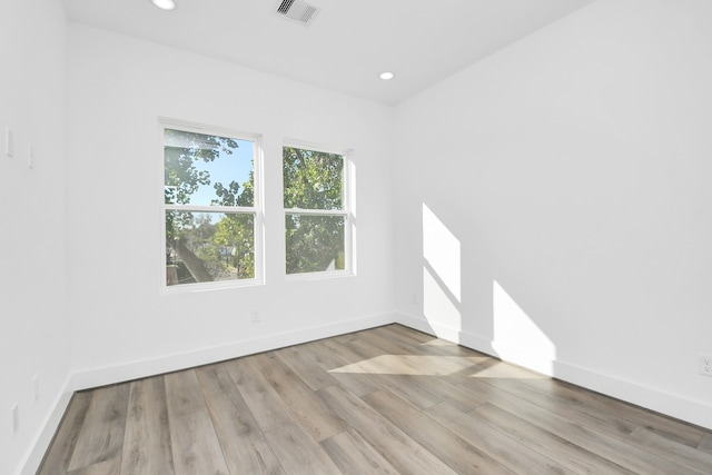 empty room with light wood-type flooring