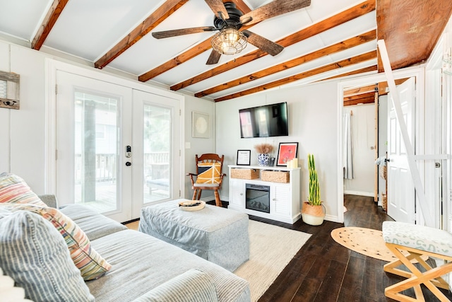 living room with ceiling fan, dark hardwood / wood-style floors, beamed ceiling, and french doors