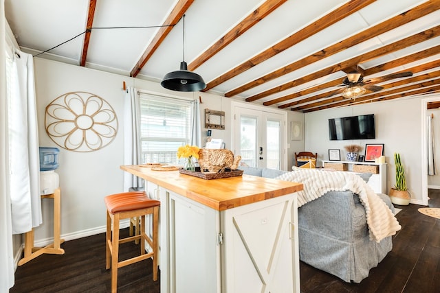 kitchen featuring white cabinets, dark hardwood / wood-style flooring, french doors, and wood counters