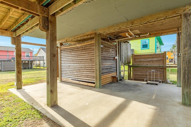 view of patio featuring an outbuilding