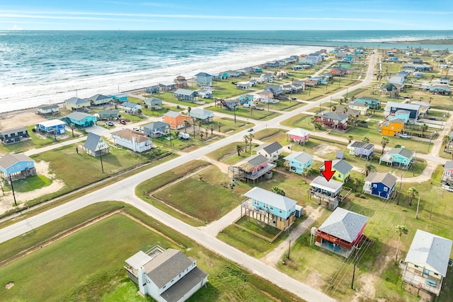 bird's eye view with a beach view and a water view