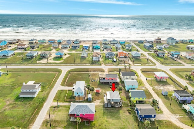 bird's eye view featuring a view of the beach and a water view