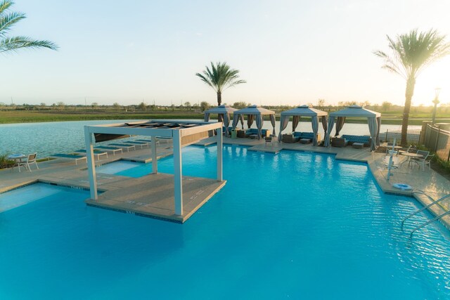 view of swimming pool featuring a gazebo and a patio