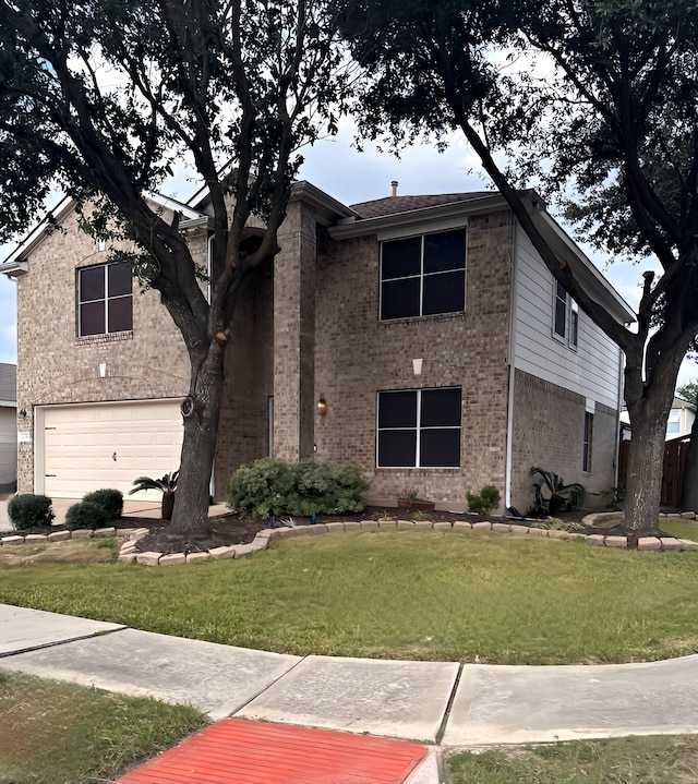 front facade featuring a garage and a front yard