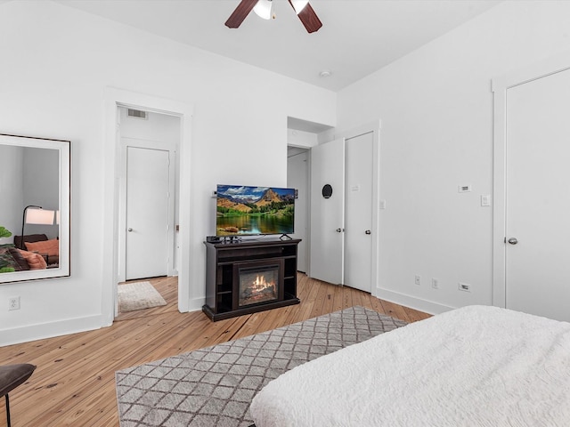 bedroom featuring hardwood / wood-style flooring and ceiling fan