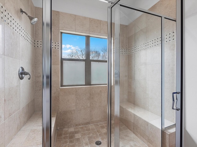 bathroom with a shower with shower door