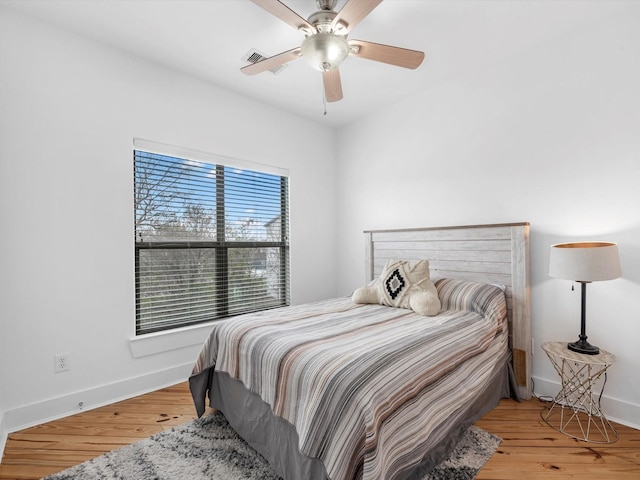 bedroom featuring hardwood / wood-style flooring and ceiling fan