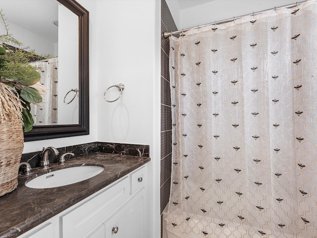 bathroom featuring vanity and walk in shower