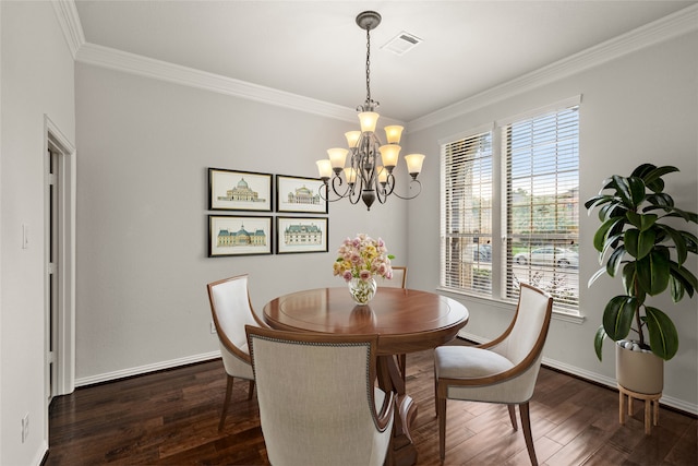 dining room with a notable chandelier, ornamental molding, and dark wood-type flooring