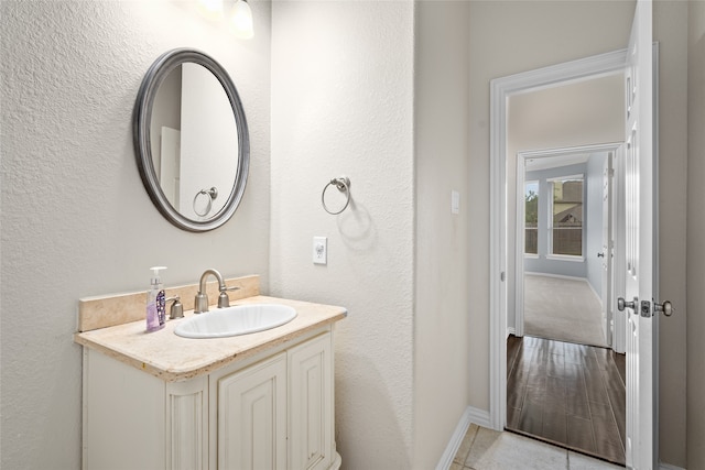 bathroom with tile patterned flooring and vanity