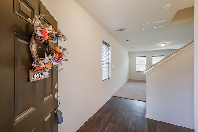 corridor featuring dark hardwood / wood-style floors