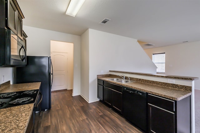 kitchen featuring sink, black appliances, and dark hardwood / wood-style floors