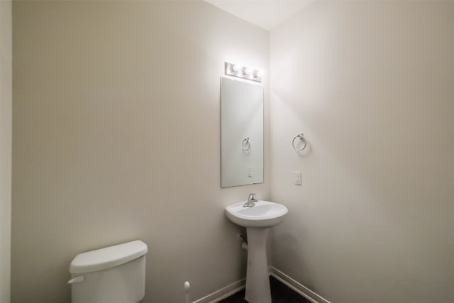 bathroom featuring sink and toilet