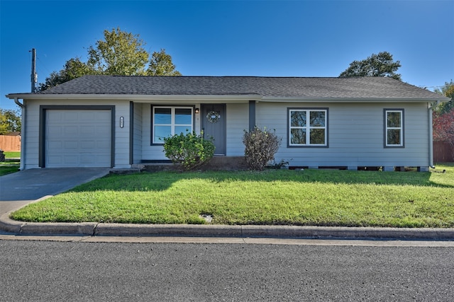 single story home with a front yard and a garage