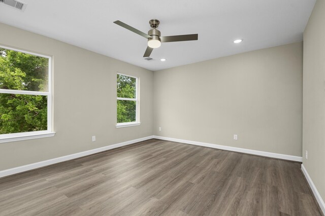 unfurnished room featuring hardwood / wood-style flooring and ceiling fan