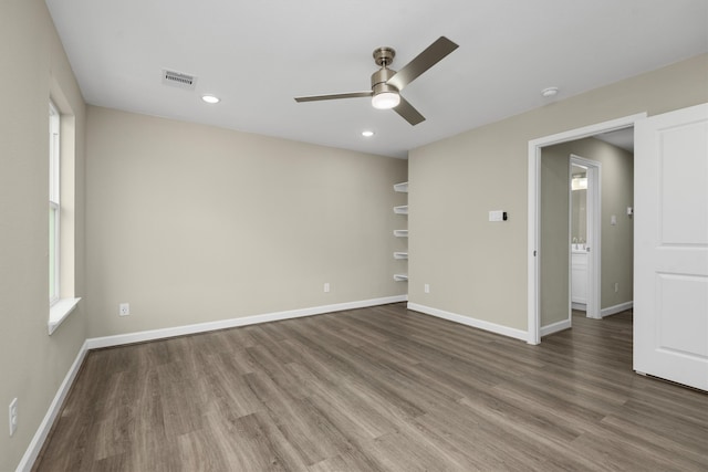 empty room featuring ceiling fan and wood-type flooring