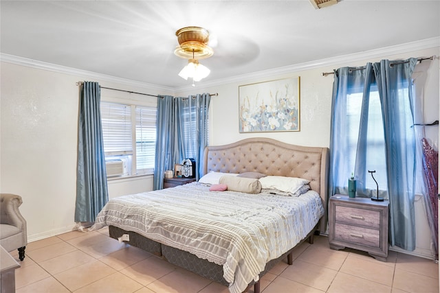 bedroom with ceiling fan, light tile patterned floors, and ornamental molding