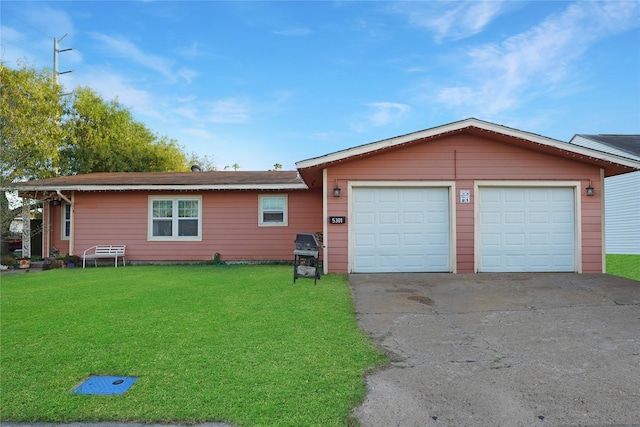 single story home with a front yard and a garage