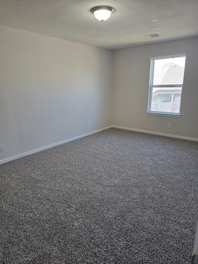 spare room featuring carpet