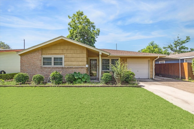 ranch-style home featuring a garage and a front yard