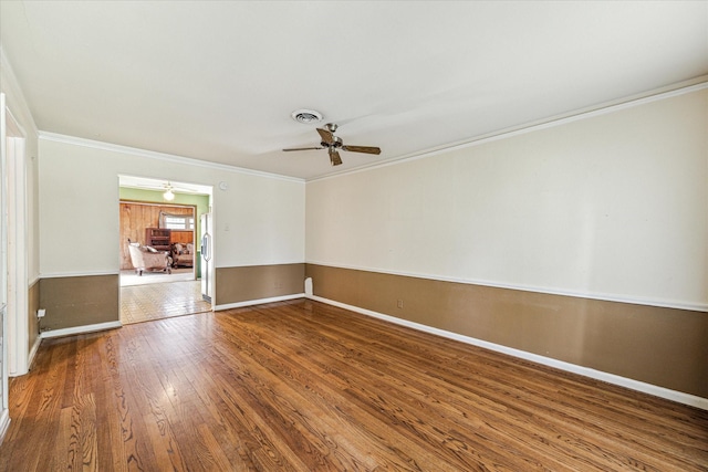 331 Surratt Dr, Houston, TX 77091 - empty room featuring ceiling fan, hardwood / wood-style floors, ornamental molding, and baseboards
