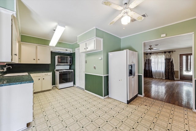 kitchen featuring white appliances, crown molding, sink, ceiling fan, and light wood-type flooring