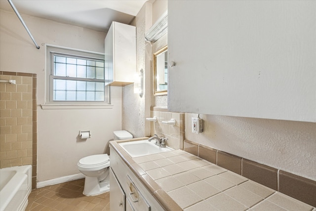 full bathroom featuring tile patterned floors, vanity, toilet, and bathing tub / shower combination