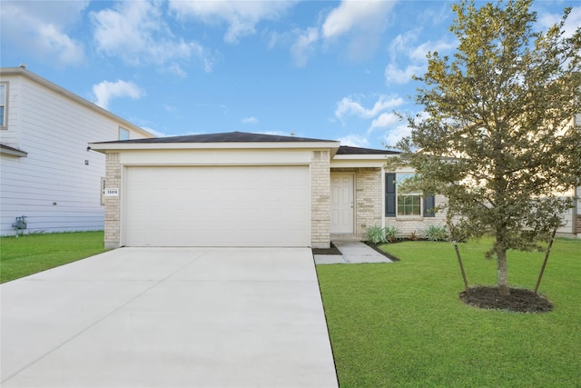 ranch-style home with a front yard and a garage