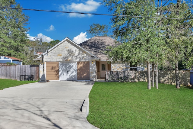 view of front of property with a garage and a front lawn