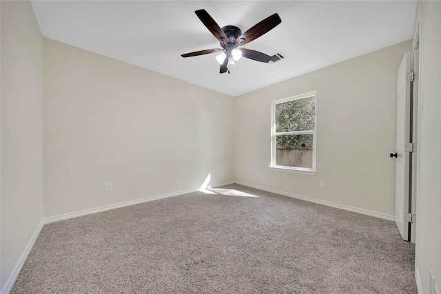 12466 Royal Lake Dr, Conroe, TX 77303 - carpeted empty room with visible vents, a ceiling fan, and baseboards